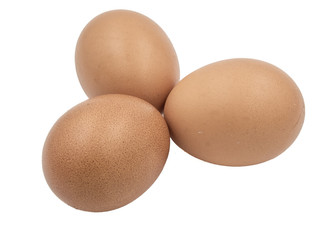 Three chicken eggs on white background
