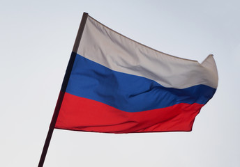Russia flag waving in the wind against the sky