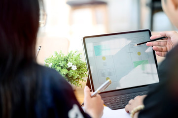 Team of young UX designers creating mobile app layout