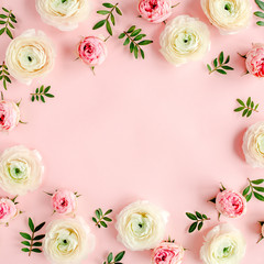 Floral background frame made of pink ranunculus and roses flower buds on pink background.  Flat lay, top view floral background.