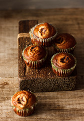 Homemade Muffins on a dark wooden table in rustic style
