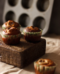 Homemade Muffins on a dark wooden table in rustic style