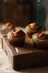 Homemade Muffins on a dark wooden table in rustic style