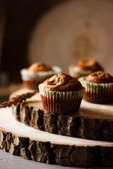 Homemade Muffins on a dark wooden table in rustic style