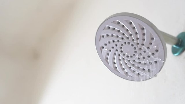 Water flowing from a leaking shower head. Concept of save water and water waste. Full HD MP4