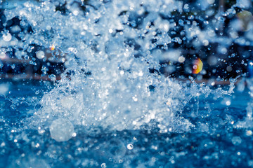 Abstract splash of water on a swimming pool