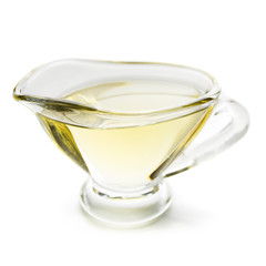 Olive oil in glass jar on white