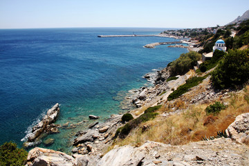 island of Greece. The island of Ikaria in the Aegean sea. Turquoise, blue sea. Rocky shore. Tourism and travel around the world.