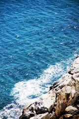 island of Greece. The island of Ikaria in the Aegean sea. Turquoise, blue sea. Rocky shore. Tourism and travel around the world.