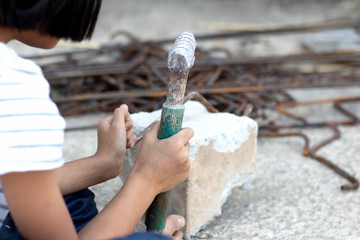 Children working at construction site for world day against child labour concept: