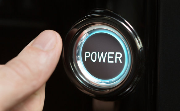Male finger pushing button with text Power