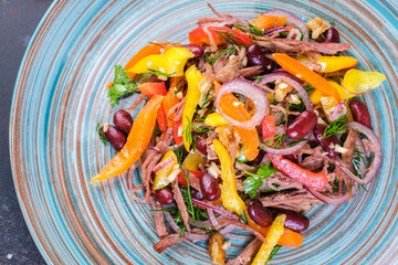 Red beans and wild rocket healthy salad with meat flakes with olive oil