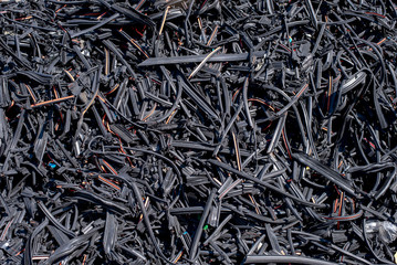 Close up of shredded recycled rubber waste on pile