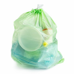Plastic bag full of plastic trash on white