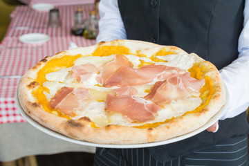 Delicious pizza Parma according to an Italian recipe