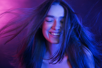 Woman Colorful Portrait. Girl playing with hair