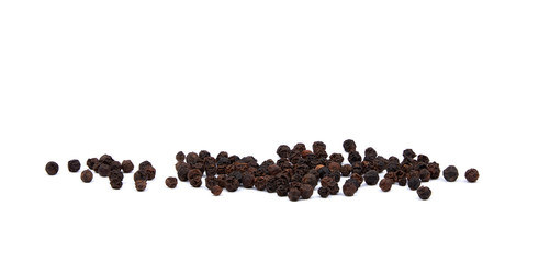 Close-up view of a pile of black pepper. Spices isolated on white background.