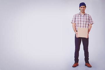 Asian young man holding box package, delivery man