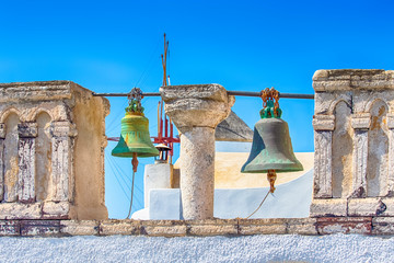 Obraz premium Famous Travel places. Church of St.Catherine (The Holy monument of Ia) in Oia Village in Santorini Island in Greece. Classic Church With Bells and Pillars.