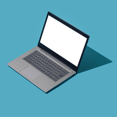 Gray metallic laptop with blank screen