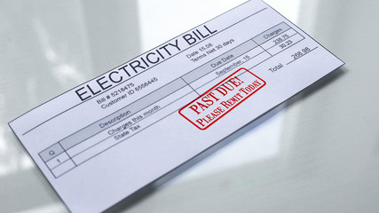 Fototapeta premium Past due seal stamped on electricity bill, month expenses, payment for services