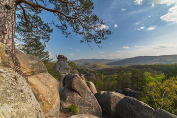 Warm weather is in the mountain forests of Ukrainian Carpathians on the rocks of the Dovbush
