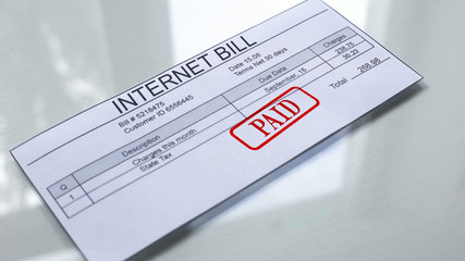 Internet bill paid, seal stamped on document, payment for services, tariff