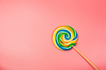 Colorful lollipop. Top view pink pastel background