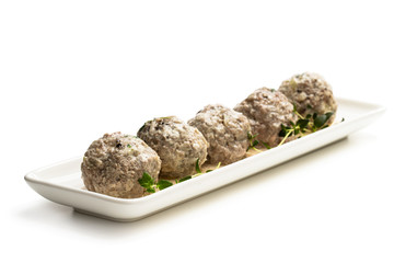 Meat balls in cream sauce isolated on white
