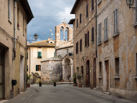 Fototapeta Ancient stone church in San Quirico D'Orcia, old medieval village in the Tuscan hills.