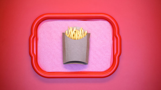 French-fried potatoes carton box on tray on red background, take away snack