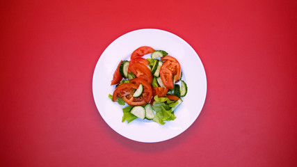 Fresh organic salad on white plate bright background, healthy nutrition, lunch
