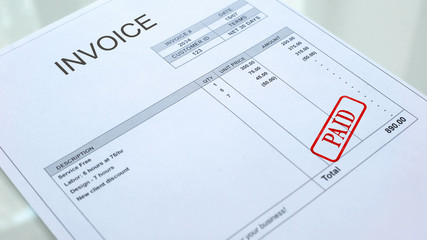 Paid seal stamped on invoice document, business bills, accountancy expense