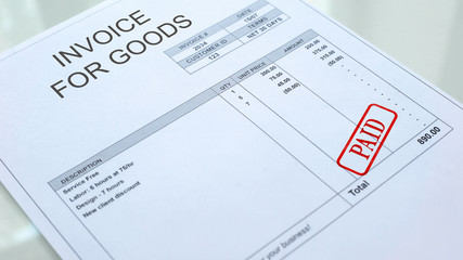 Paid seal stamped on invoice for goods document, business papers, economics