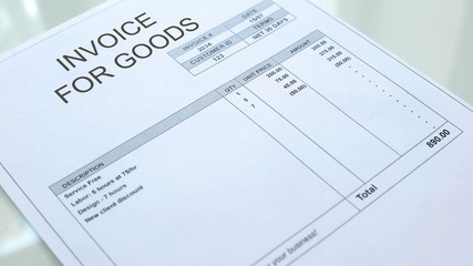 Invoice for goods commercial document on table, business accounting, template