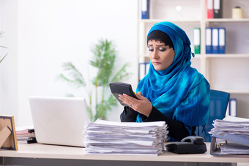 Female employee in hijab working in the office