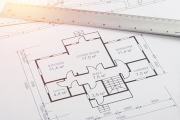 Male hands, Orange helmet, pencil, architectural construction drawings, tape measure. The architect designs the building. The concept of architecture, construction, engineering, design. Copy space.