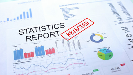 Statistics report rejected, hand stamping seal on official document, statistics
