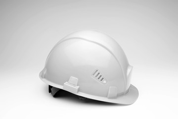 White construction helmet on a light background. The concept of architecture, construction, engineering, design. Copy space.