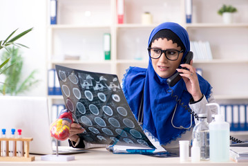 Female doctor in hijab working in the hospital