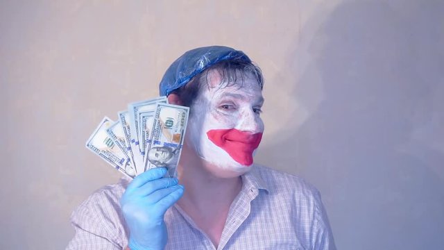 excerpt from the short speech of the funny actor men mime.actor performs with a stack of hundred dollar bills.pantomime.