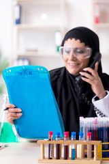 Female chemist in hijab working in the lab
