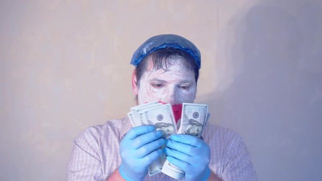 excerpt from the short speech of the funny actor men mime.actor performs with a stack of hundred dollar bills.pantomime.
