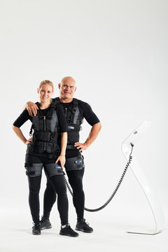 positive happy man and woman having a rest during fitness training. full length photo. health and body care, wellness, wellbeing