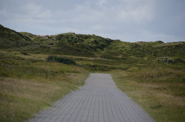 sand way to the North sea beach and beautiful sky, north sea, island langeoog