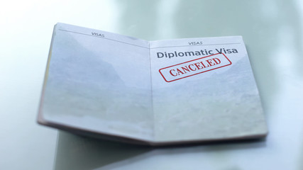 Diplomatic visa canceled, seal stamped in passport, customs office, travelling