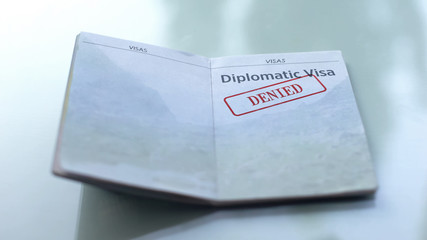 Diplomatic visa denied, seal stamped in passport, customs office, travelling