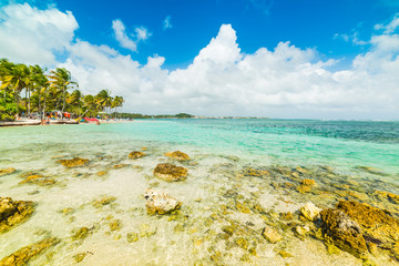 Clear water and rocks in La Caravelle beach in Guadeloupe