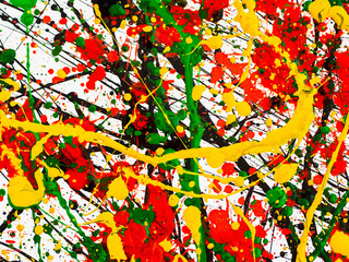splashes on red and black and green and yellow paint