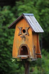 beautiful wooden bird house in the garden